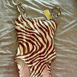 One piece Michael Kors swimsuit.   Never worn.  New with tags.